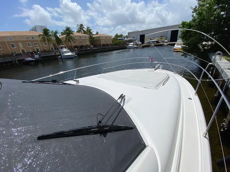 Slide: The Image of Prestige 440 S yacht, 2013 model, docked in a sunny marina. - 18
