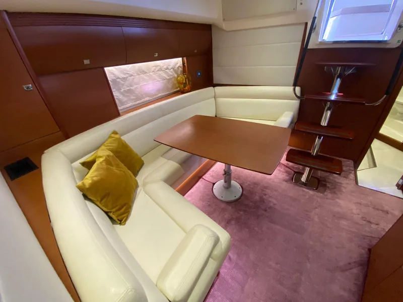 Slide: The Image of Luxurious 2013 Prestige 440 S yacht interior with elegant seating and dining area. - 31