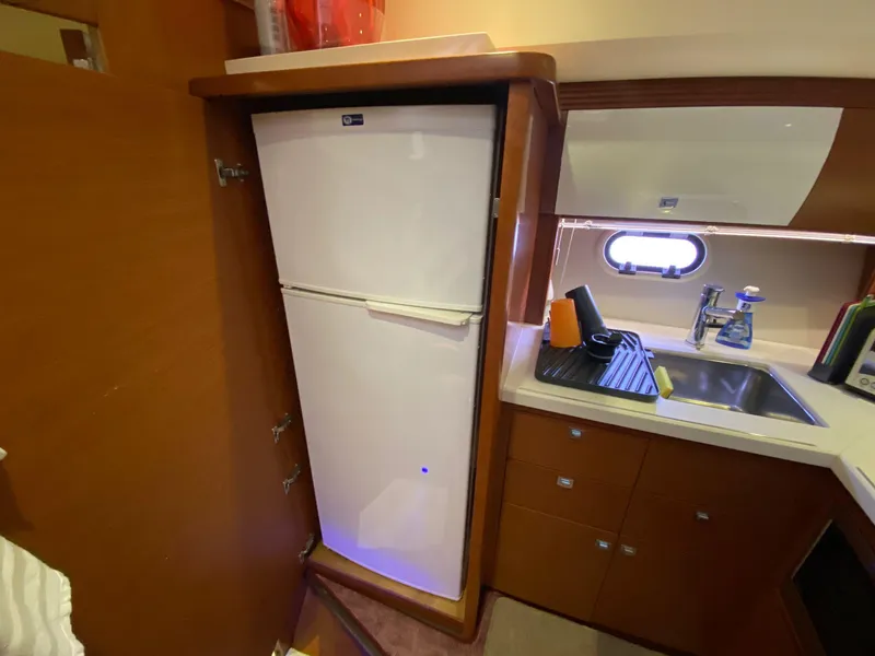 Slide: The Image of 2013 Prestige 440 S yacht kitchen with fridge and sink. - 33