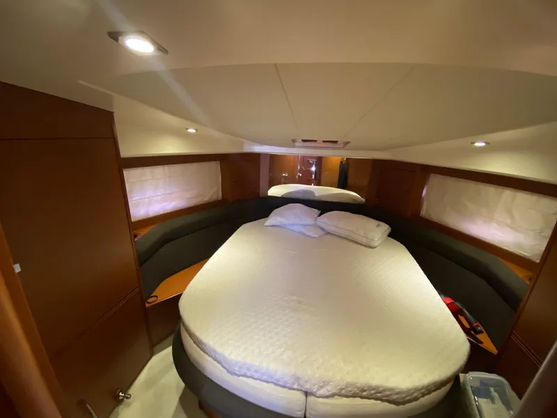 Slide: The Image of Luxurious cabin interior of 2013 Prestige 440 S yacht with cozy bed and ambient lighting. - 36