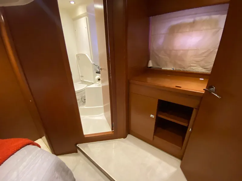 Slide: The Image of Interior of 2013 Prestige 440 S yacht with bathroom and wooden cabinetry. - 38