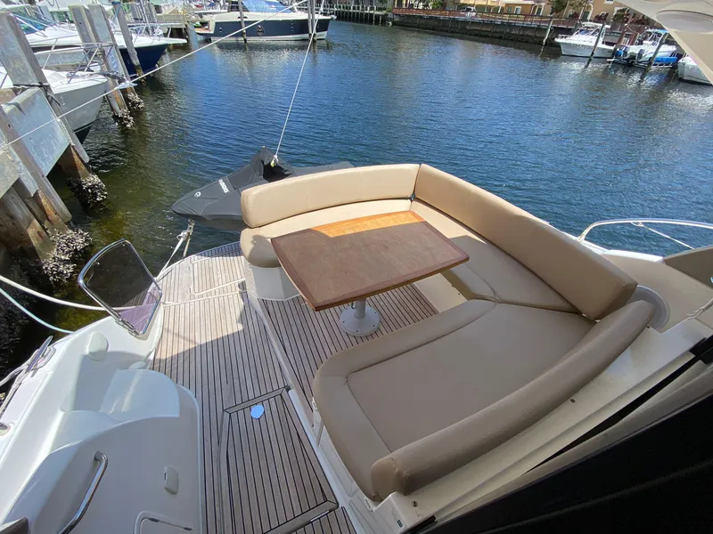 Slide: The Image of Luxury 2013 Prestige 440 S yacht with elegant outdoor seating area. - 41