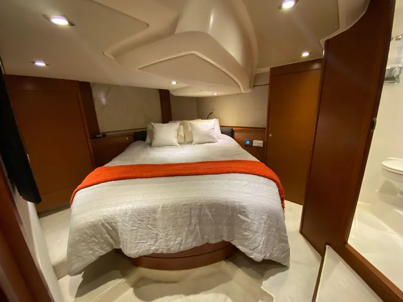 Slide: The Image of Luxurious cabin interior of 2013 Prestige 440 S yacht with cozy bed and ambient lighting. - 44