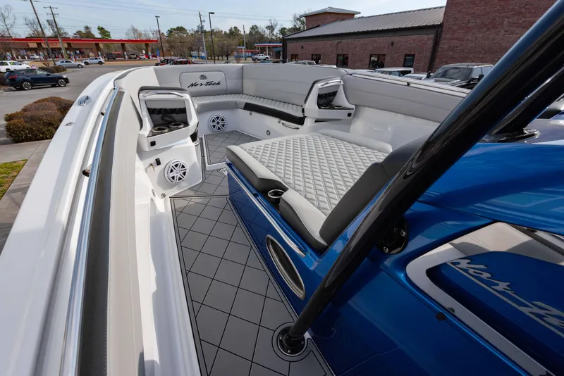 Slide: The Image of 2024 Nor-Tech 390 Center Console boat with spacious seating and modern design. - 13
