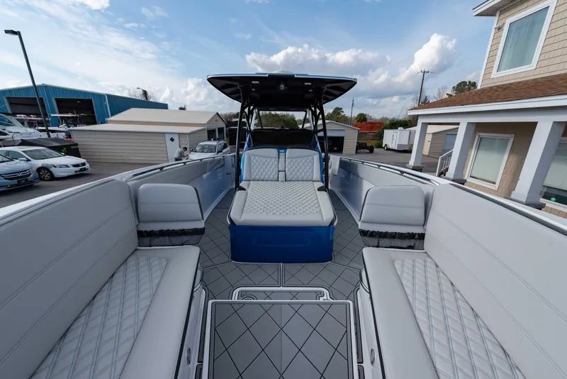 Slide: The Image of 2024 Nor-Tech 390 Center Console boat with spacious seating and modern design. - 16