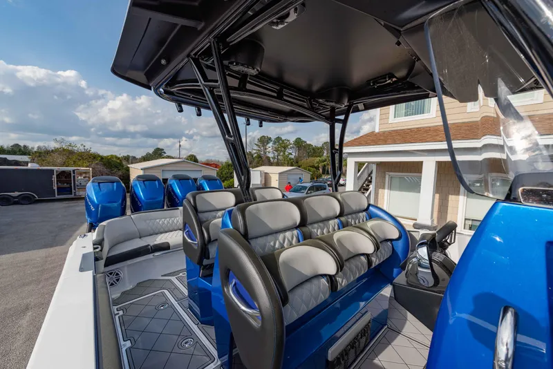 Slide: The Image of 2024 Nor-Tech 390 Center Console boat interior with seating and console. - 17
