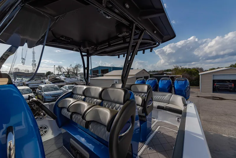 Slide: The Image of 2024 Nor-Tech 390 Center Console boat with luxurious seating and modern design. - 18