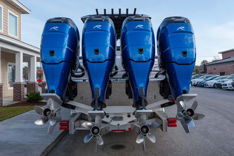 Slide: The Image of 2024 Nor-Tech 390 Center Console with quad blue outboard engines. - 5