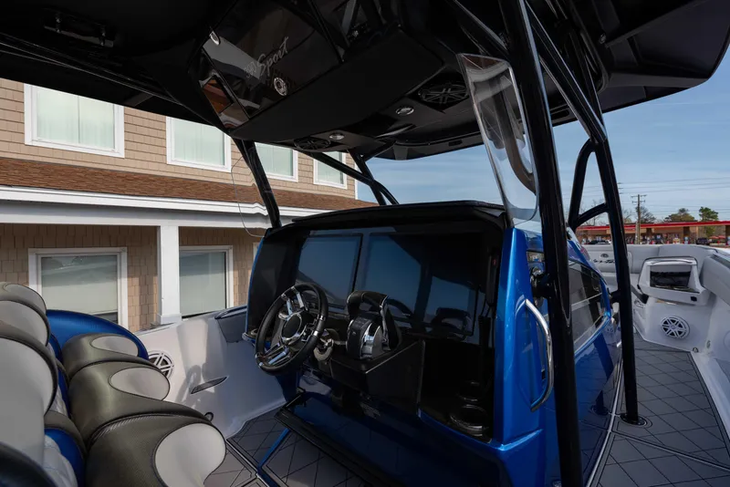 Slide: The Image of 2024 Nor-Tech 390 Center Console boat interior with modern helm and seating. - 7