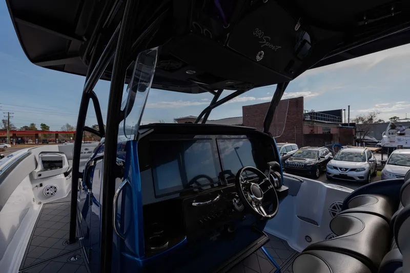 Slide: The Image of 2024 Nor-Tech 390 Center Console boat interior with advanced navigation system and luxurious seating. - 8