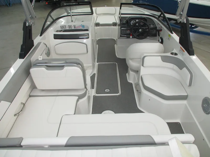 Slide: The Image of Interior view of a 2016 Bayliner VR6 Bowrider I/O with gray and white seating. - 3