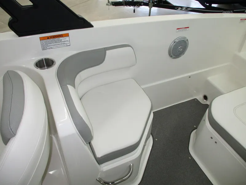 Slide: The Image of Interior view of a 2016 Bayliner VR6 Bowrider I/O with gray and white seating. - 6