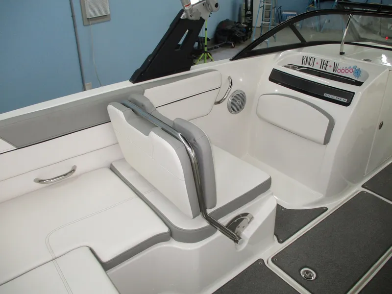 Slide: The Image of Interior of a 2016 Bayliner VR6 Bowrider I/O with gray and white seating. - 4