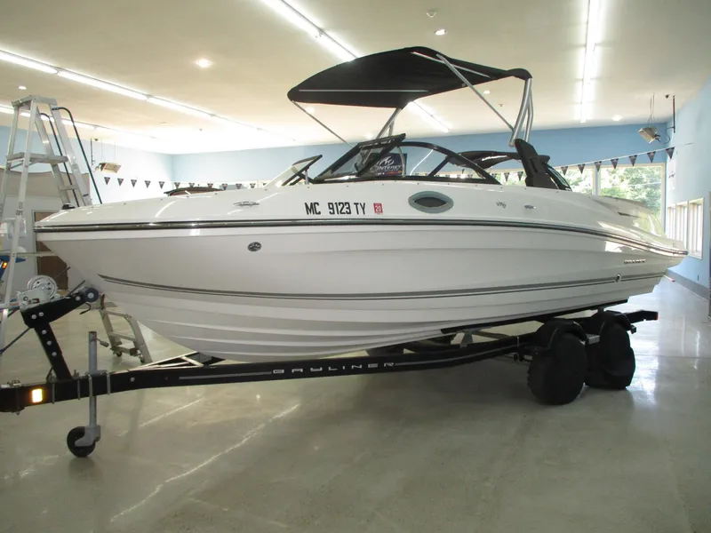 Slide: The Image of A 2016 Bayliner VR6 Bowrider I/O on a trailer in a showroom. - 0