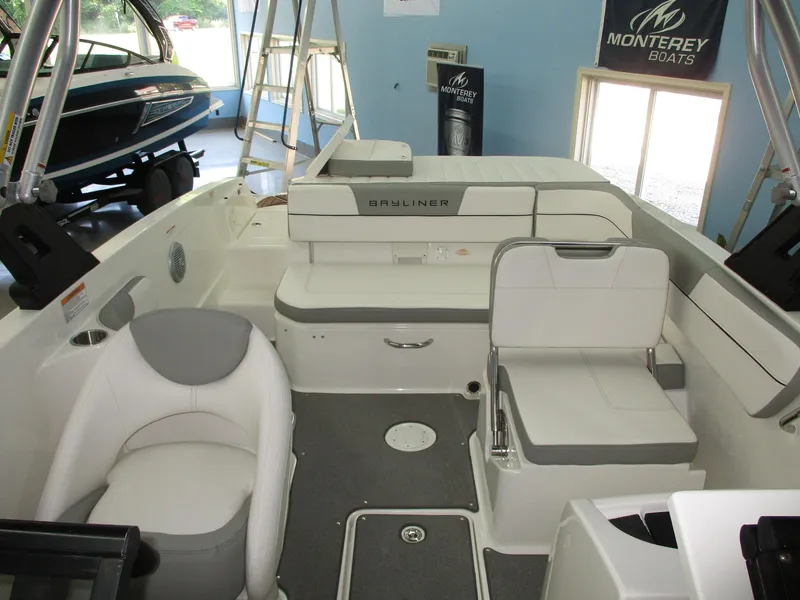 Slide: The Image of The image shows the cockpit of a 2016 Bayliner VR6 Bowrider I/O with white seating. - 9