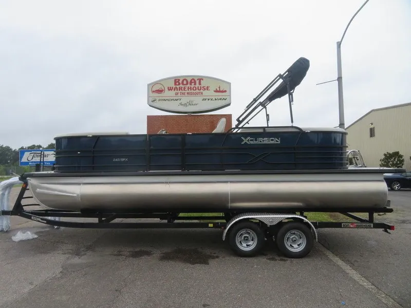 Slide: The Image of 2022 Xcursion 243RFX pontoon boat on a trailer at Boat Warehouse. - 1