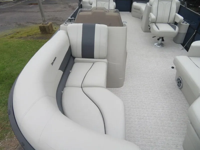 Slide: The Image of 2022 Xcursion 243RFX pontoon boat interior with plush seating and modern design. - 10