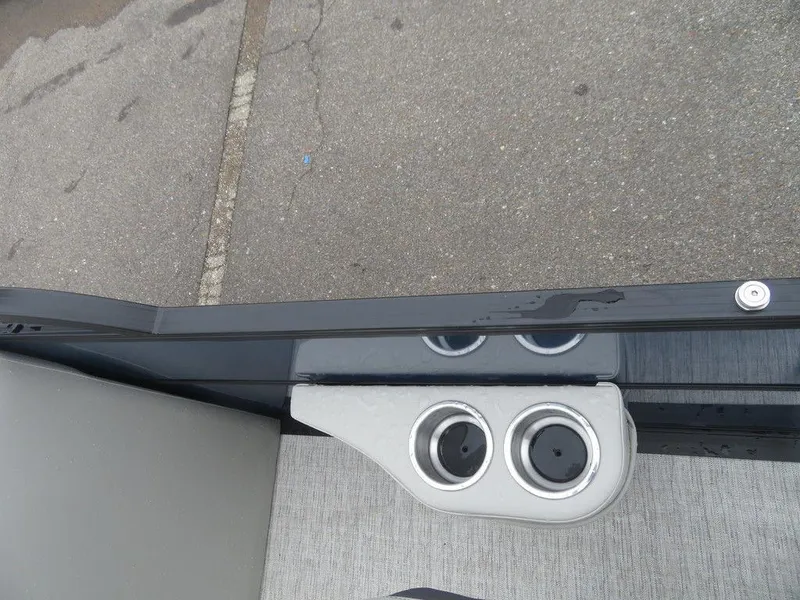 Slide: The Image of 2022 Xcursion 243RFX boat cup holders and seating area. - 13