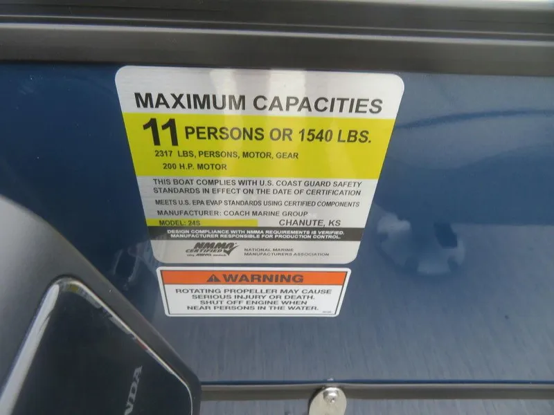 Slide: The Image of 2022 Xcursion 243RFX boat capacity label, 11 persons or 1540 lbs, safety warning. - 14
