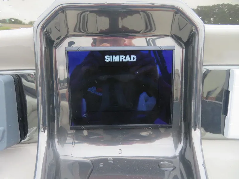 Slide: The Image of 2022 Xcursion 243RFX boat dashboard with Simrad display. - 17
