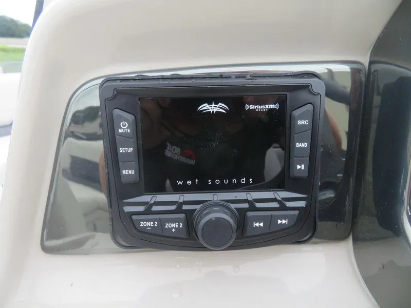 Slide: The Image of Wet Sounds audio system on 2022 Xcursion 243RFX boat dashboard. - 20
