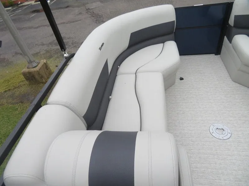 Slide: The Image of 2022 Xcursion 243RFX boat interior with gray and white cushioned seating. - 22