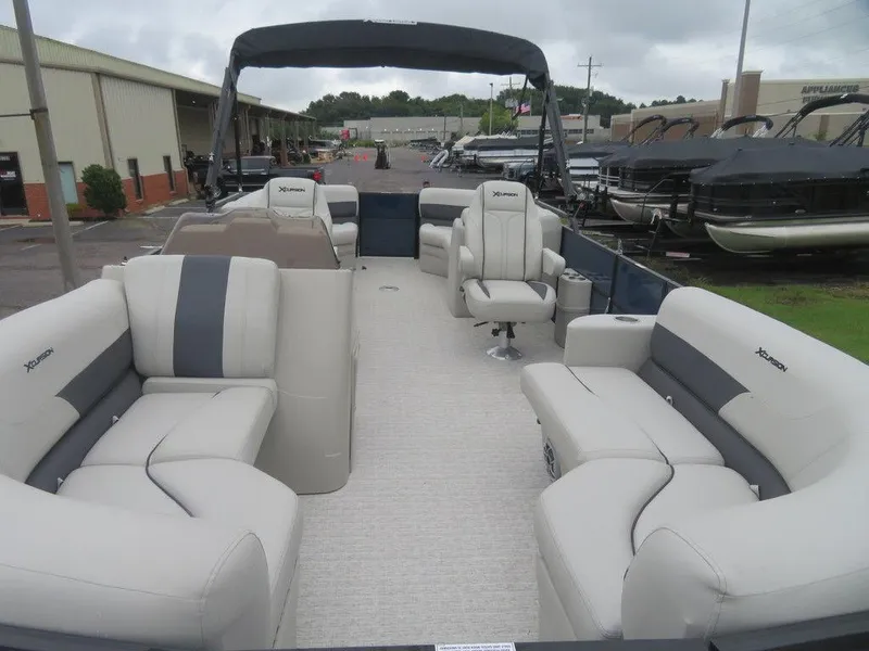 Slide: The Image of 2022 Xcursion 243RFX pontoon boat with spacious seating and modern design. - 4