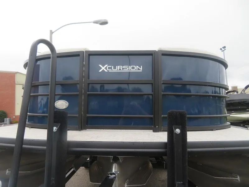 Slide: The Image of 2022 Xcursion 243RFX pontoon boat front view. - 6