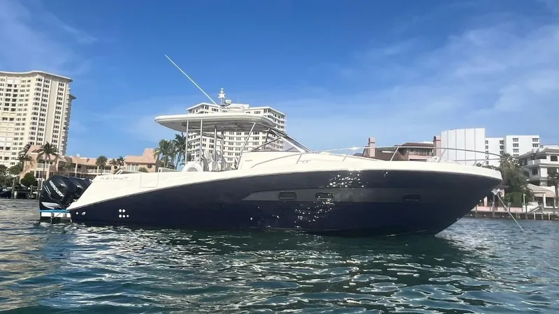 Slide: The Image of Azimut Atlantis Verve Outboard 2014 yacht on water, cityscape background. - 0