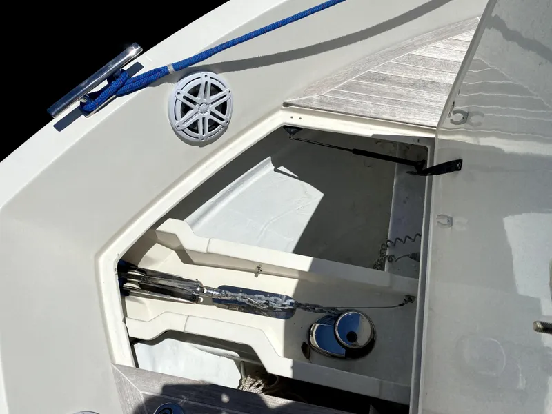 Slide: The Image of Azimut Atlantis Verve Outboard 2014 boat deck with storage compartment and blue rope. - 12