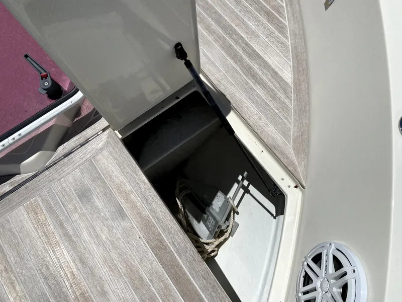 Slide: The Image of 2014 Azimut Atlantis Verve Outboard storage compartment with wooden deck and speaker. - 13