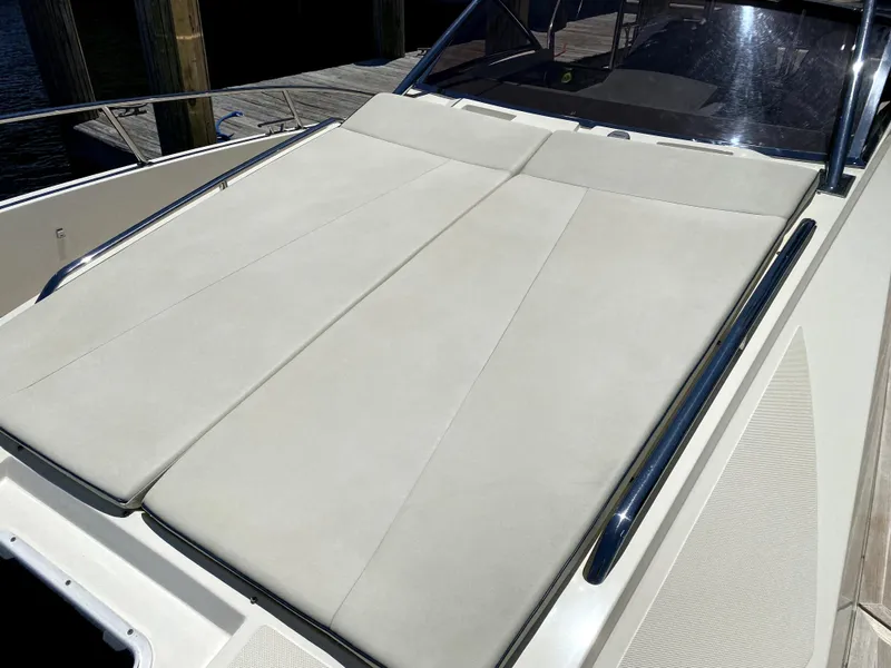 Slide: The Image of 2014 Azimut Atlantis Verve Outboard sun deck with beige cushions. - 14