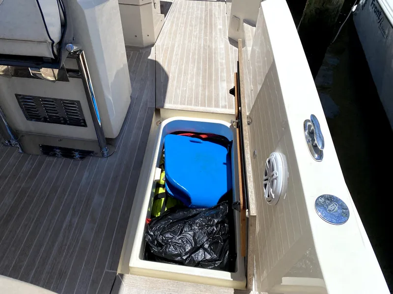 Slide: The Image of Azimut Atlantis Verve Outboard 2014 boat storage compartment with gear and equipment. - 18