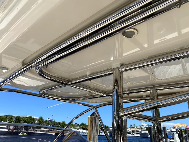 Slide: The Image of Azimut Atlantis Verve Outboard 2014, sleek chrome details, marina background. - 22