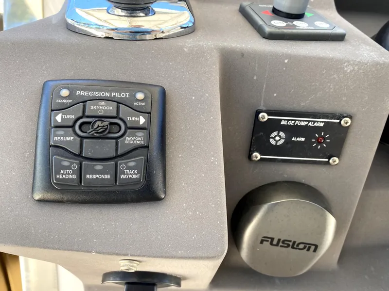 Slide: The Image of Control panel of a 2014 Azimut Atlantis Verve Outboard boat with precision pilot and bilge pump alarm. - 32