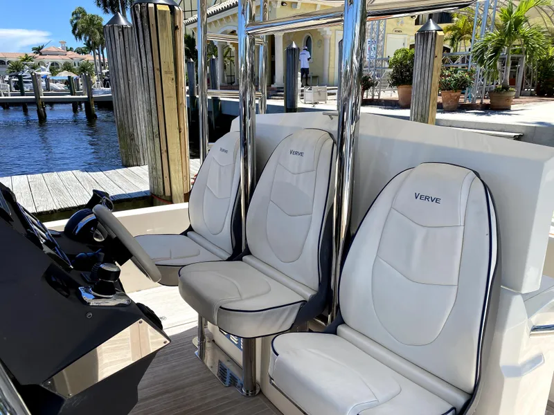 Slide: The Image of Azimut Atlantis Verve Outboard 2014 boat interior with sleek white seating. - 34