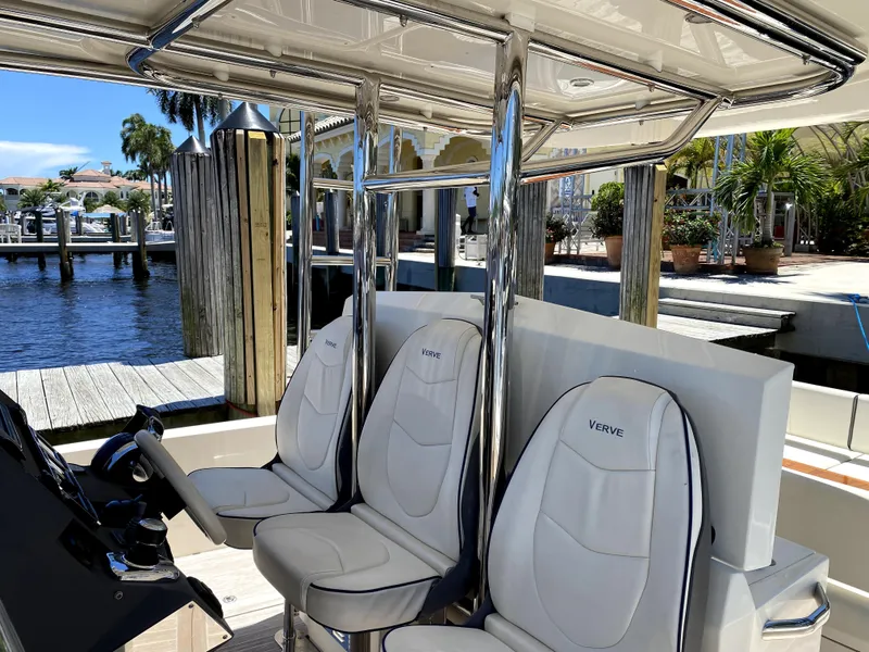 Slide: The Image of Azimut Atlantis Verve Outboard 2014 boat interior with sleek seating and waterfront view. - 35