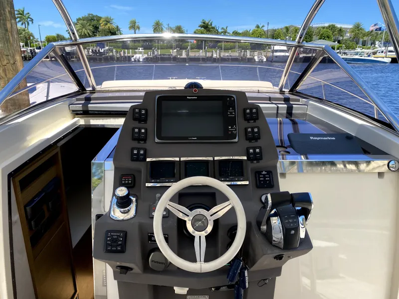 Slide: The Image of 2014 Azimut Atlantis Verve Outboard helm with modern controls and navigation system. - 37