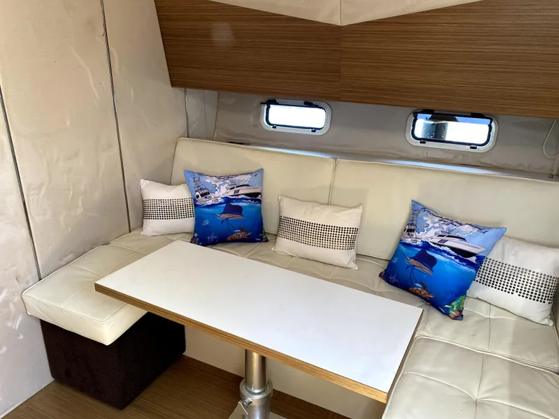 Slide: The Image of Azimut Atlantis Verve 2014 interior with white seating and decorative pillows. - 41