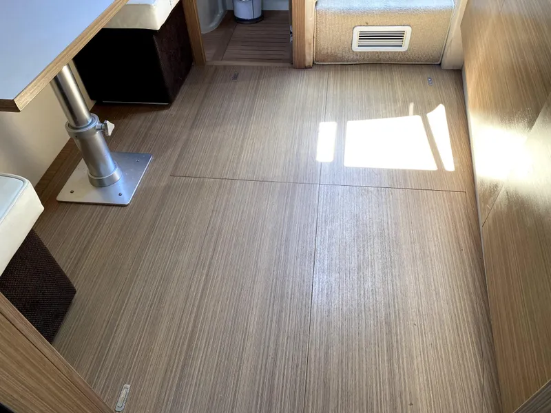 Slide: The Image of Interior of 2014 Azimut Atlantis Verve Outboard with wooden flooring and seating area. - 43