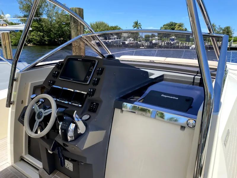 Slide: The Image of 2014 Azimut Atlantis Verve Outboard helm with modern controls and navigation system. - 45