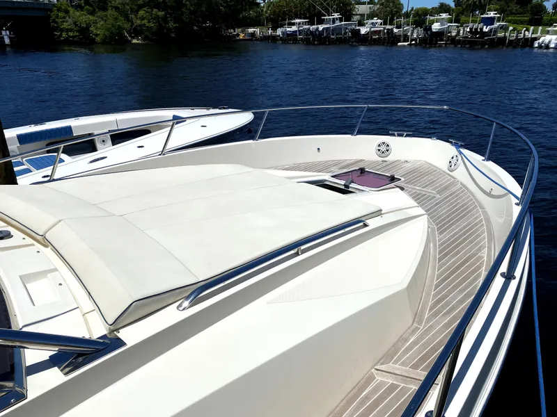 Slide: The Image of 2014 Azimut Atlantis Verve Outboard yacht on calm water, featuring spacious deck. - 47