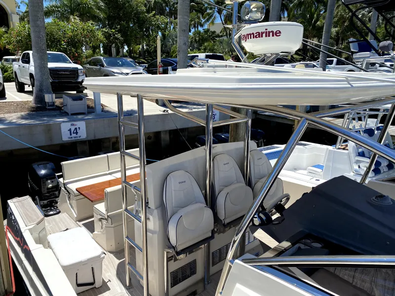Slide: The Image of 2014 Azimut Atlantis Verve Outboard boat docked, featuring sleek seating and modern design. - 48