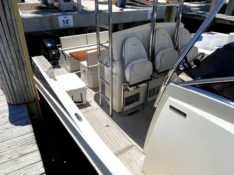 Slide: The Image of 2014 Azimut Atlantis Verve Outboard boat interior with seating and ladder at dock. - 49