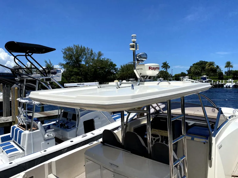 Slide: The Image of 2014 Azimut Atlantis Verve Outboard docked, featuring sleek design and advanced navigation equipment. - 6