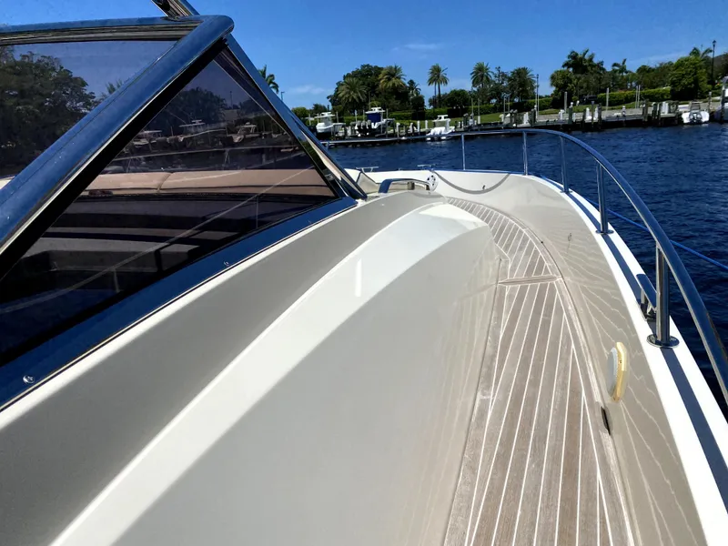 Slide: The Image of Azimut Atlantis Verve Outboard 2014 yacht deck with scenic waterfront view. - 9
