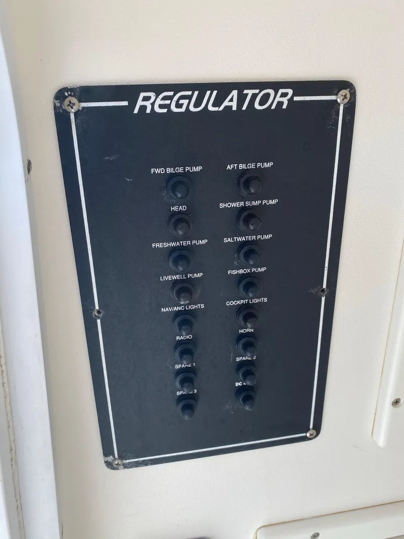 Slide: The Image of Control panel of a 2002 Regulator 32 Forward Seating boat. - 12