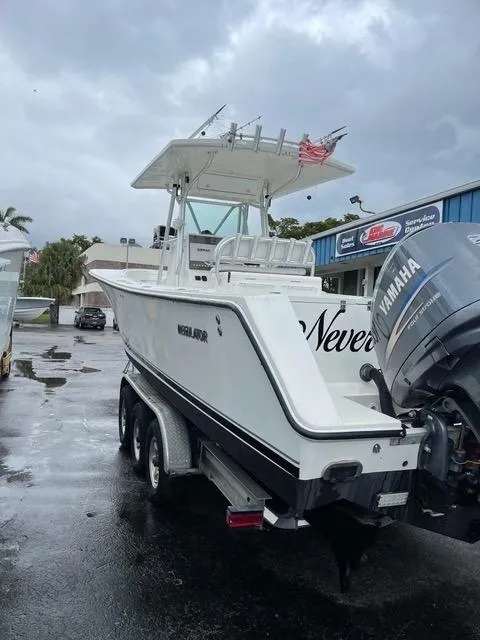 Slide: The Image of 2002 Regulator 32 Forward Seating boat with Yamaha engine on a trailer. - 4