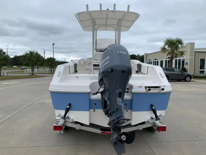 Slide: The Image of 2026 Robalo R200 Center Console boat with Yamaha engine, parked outdoors. - 3