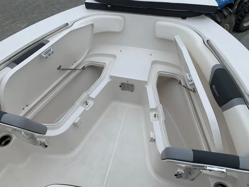 Slide: The Image of 2026 Robalo R200 Center Console boat with open storage compartments. - 11